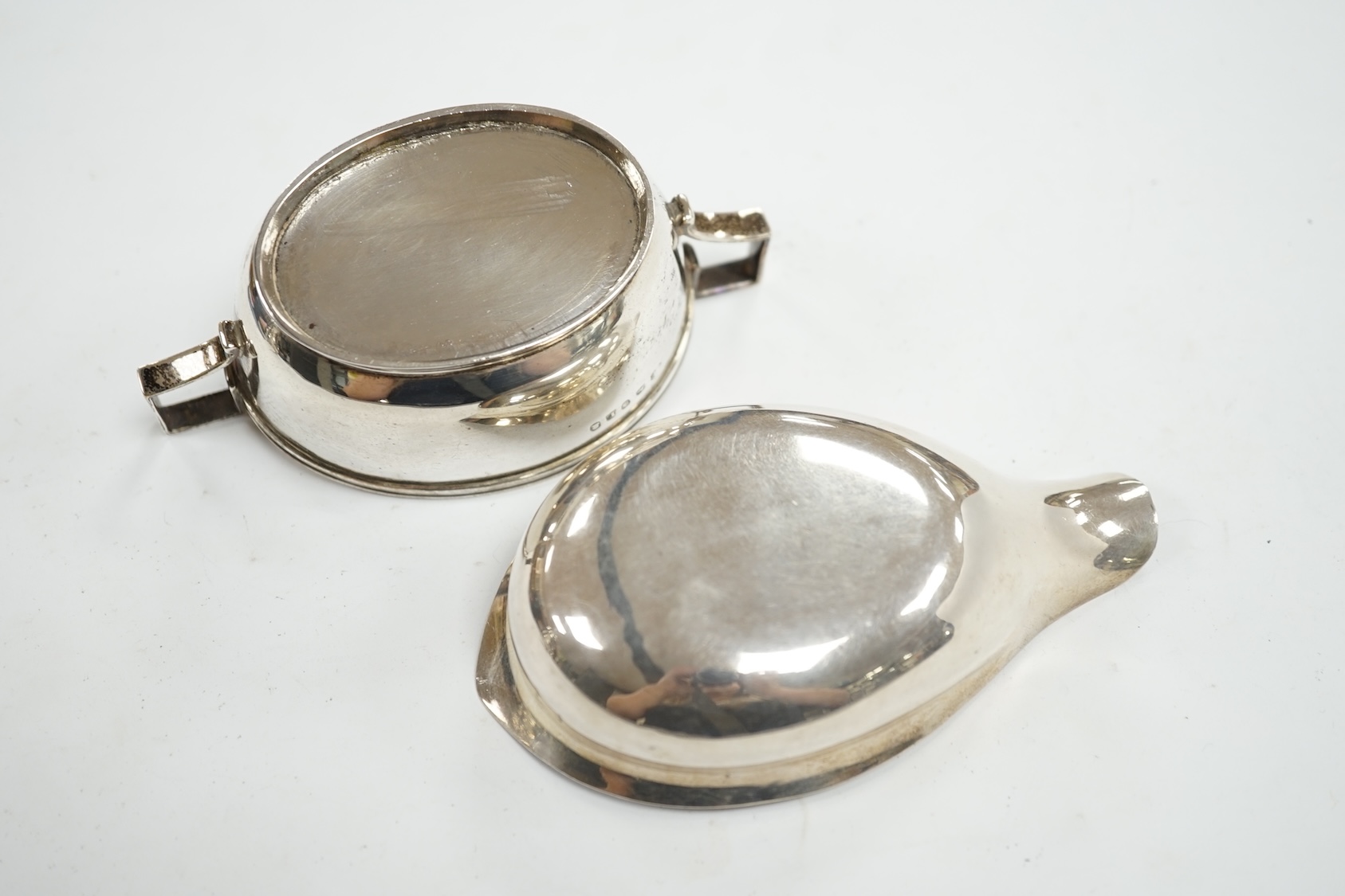 A George III silver two handled oval tub salt by John Eames, London, 1806, 12cm, together with a Georgian silver pap boat (marks rubbed). Condition - poor to fair